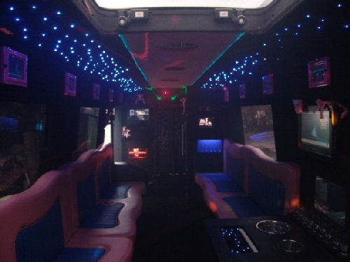 Chauffeur driven Pink Panther Party Bus limousine hire interior in Birmingham, Coventry, Dudley, Wolverhampton, Telford, Worcester, Walsall, Stafford, Midlands